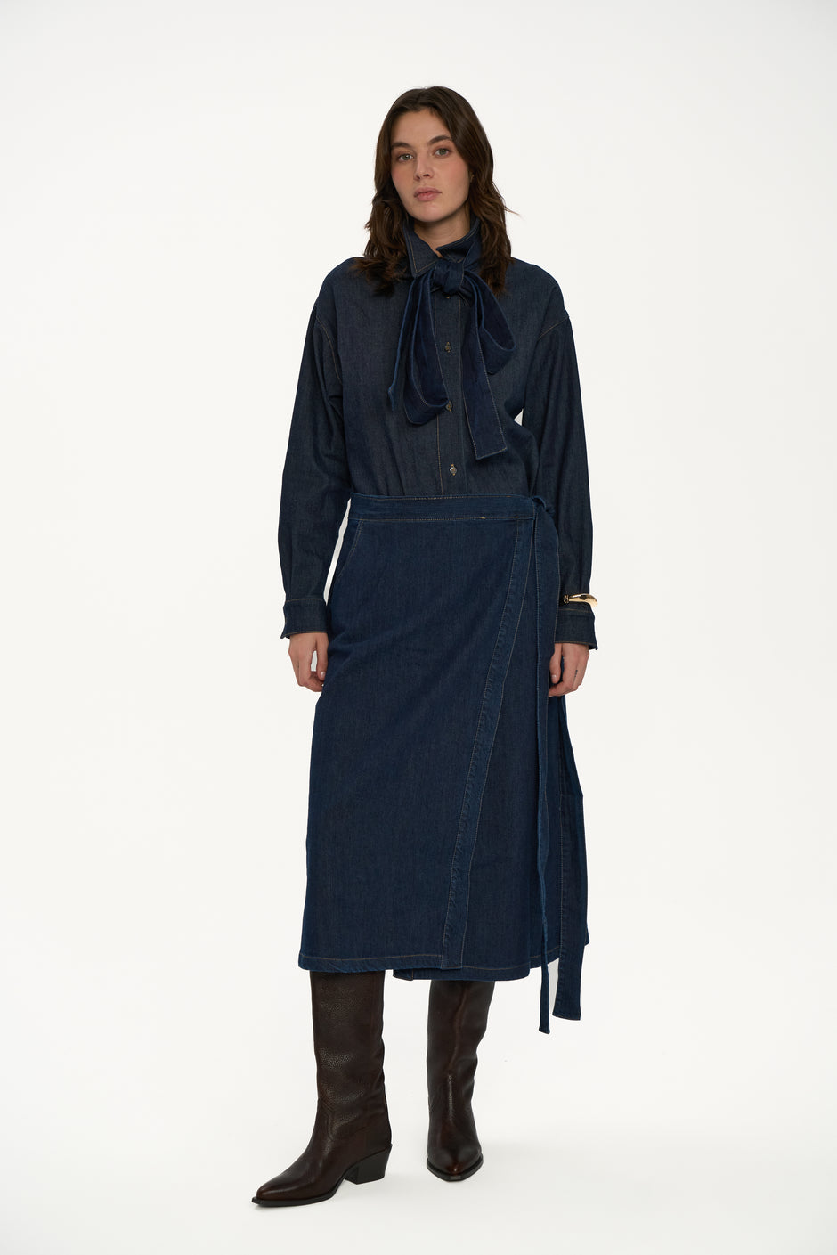Indigo wrap denim midi skirt styled with matching denim shirt and dark brown boots on model, full length front view – Inner Tiger