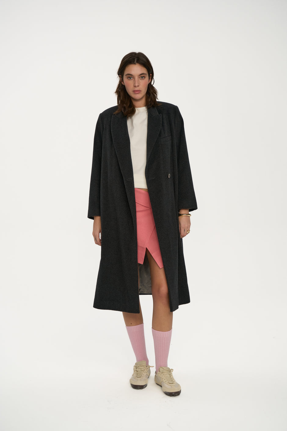 Charcoal wool single-breasted coat with notch lapels and one-button closure on model wearing cream top and sneakers, full length front view – Inner Tiger