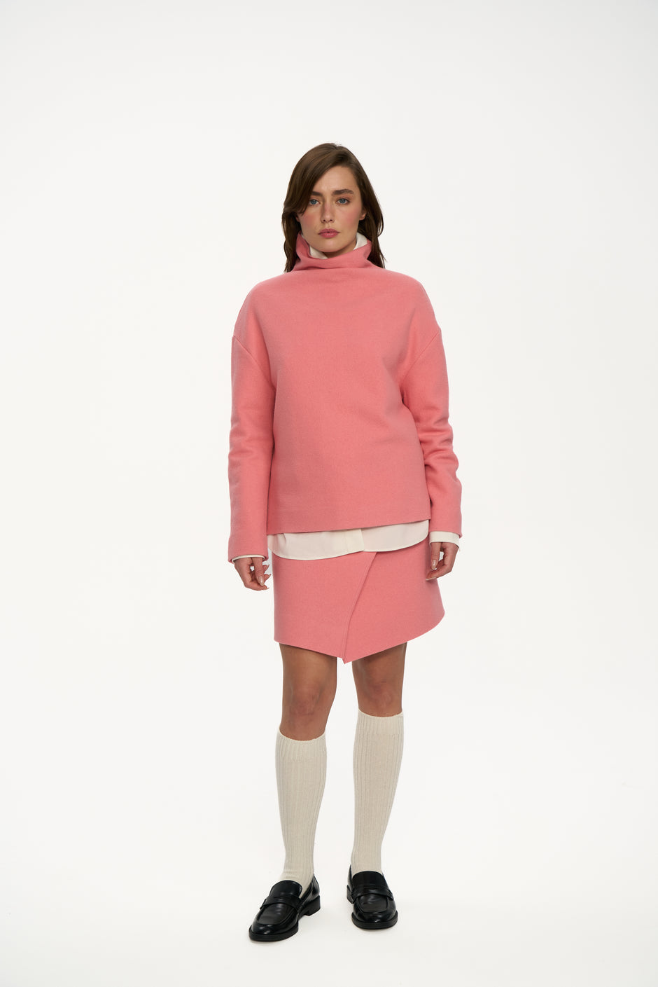 Powder pink pure wool high-neck sweater with matching wrap mini skirt on model, full length front view – Inner Tiger
